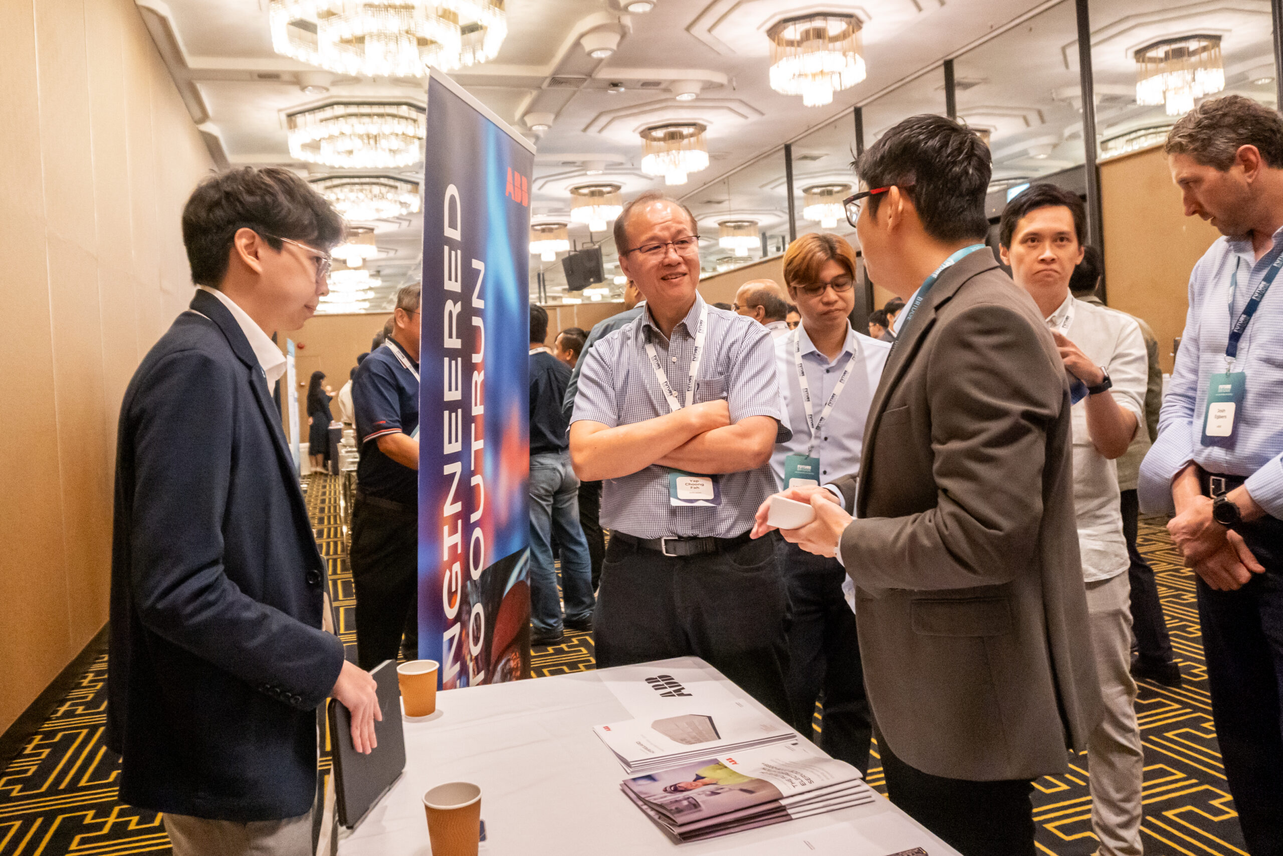 Delegates in conversation during a networking break at a Future Bridge summit